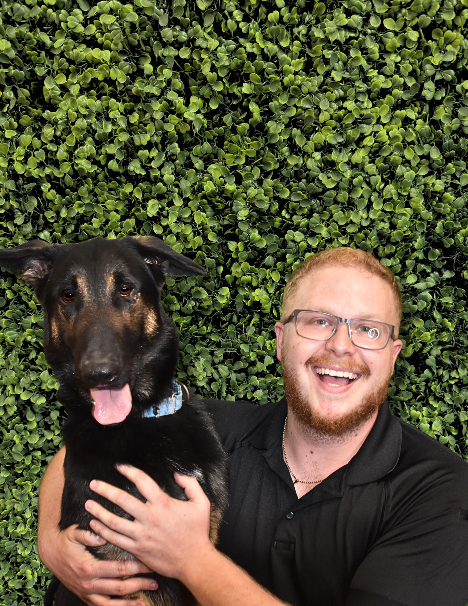 Austin Burnett, Shelter Operations Manager, with a dog.